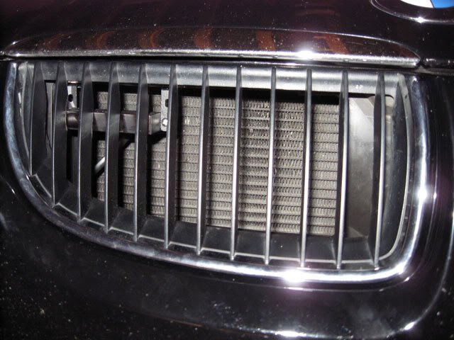 Laser jammer improperly installed behind a BMW grill