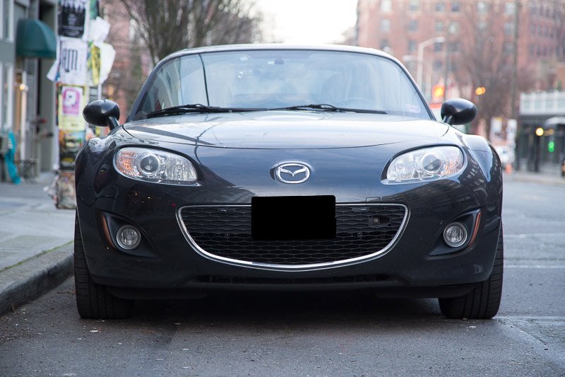 Stinger VIP (and AntiLaser Priority) jammer heads installed in the grill of my Miata