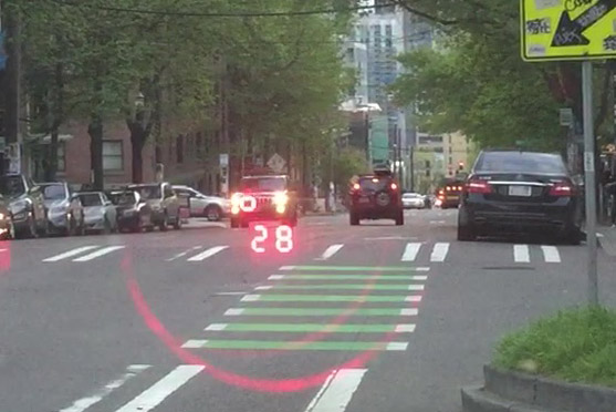 Police laser gun pinpointing a specific vehicle