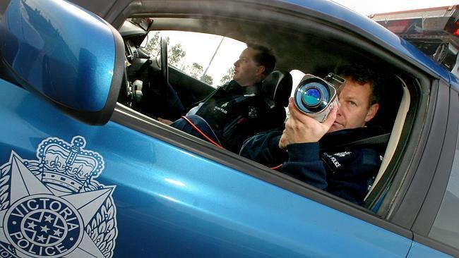 Police officer shooting a Kustom ProLaser II